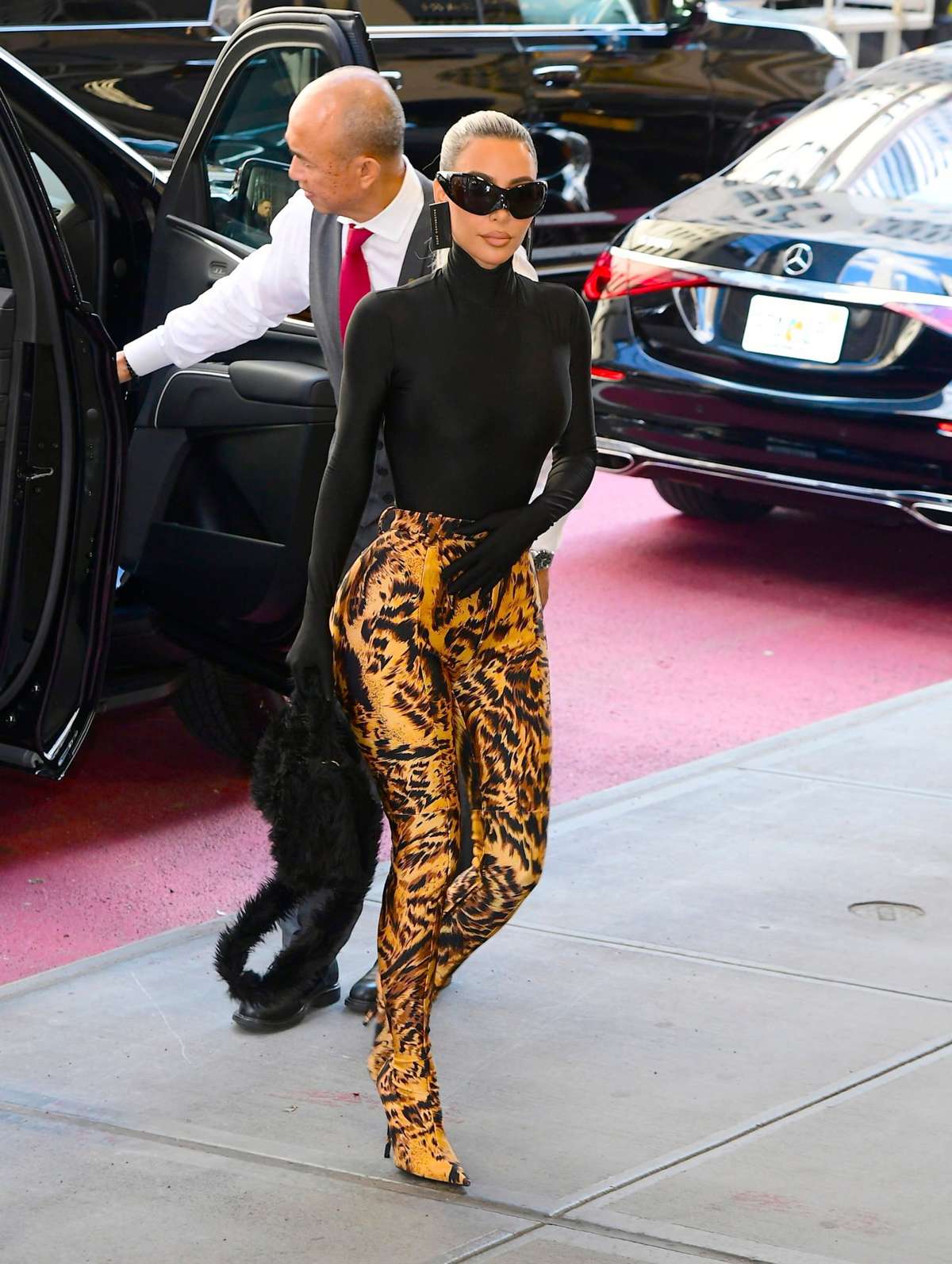 Kim Kardashian Styles a Skims Bodysuit with Yeezy Boots